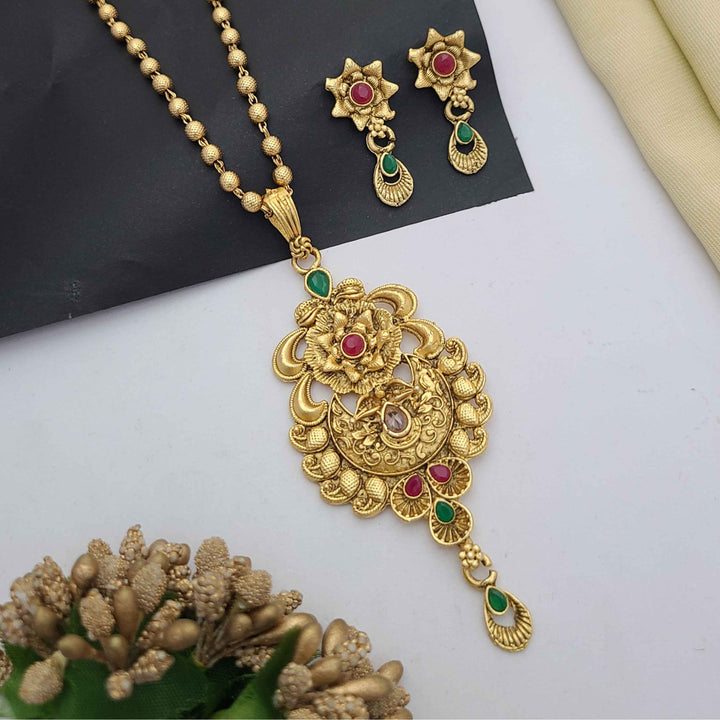 Traditional gold-plated Pandent necklace set with red and green stone detailing, paired with matching earrings – perfect imitation jewellery for women | RC Imitation Jewellery