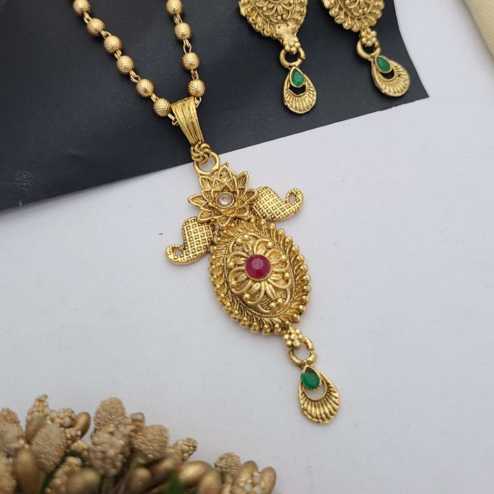 Traditional gold-plated Pandent necklace set with red and green stone detailing, paired with matching earrings – perfect imitation jewellery for women | RC Imitation Jewellery