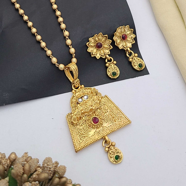 Traditional gold-plated Pandent necklace set with red and green stone detailing, paired with matching earrings – perfect imitation jewellery for women | RC Imitation Jewellery