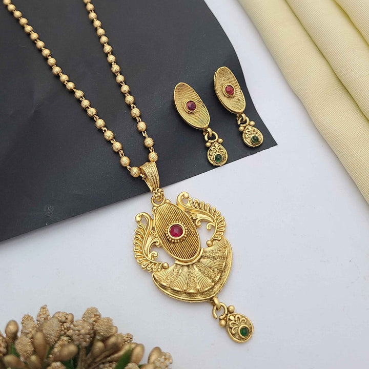 Traditional gold-plated Pandent necklace set with red and green stone detailing, paired with matching earrings – perfect imitation jewellery for women | RC Imitation Jewellery
