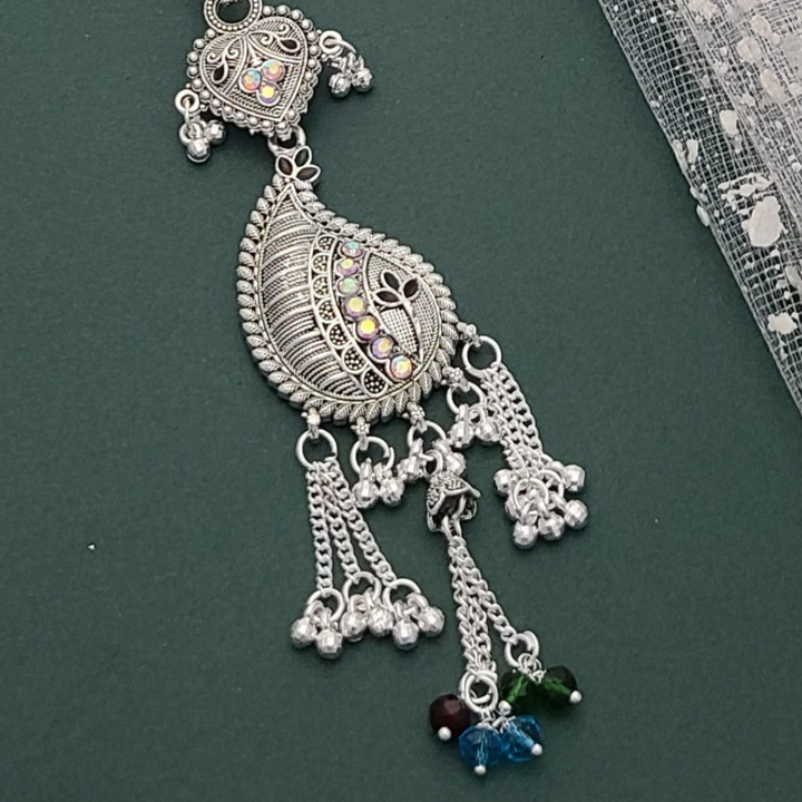 Traditional silver-colored Juda waist accessory with intricate floral and chain design, perfect for bridal and festive outfits