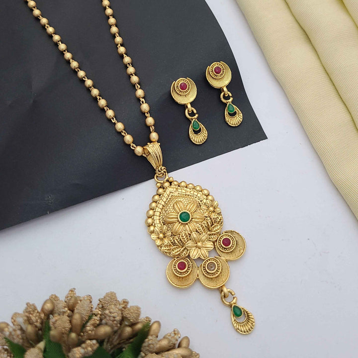 Traditional gold-plated Pandent necklace set with red and green stone detailing, paired with matching earrings – perfect imitation jewellery for women | RC Imitation Jewellery
